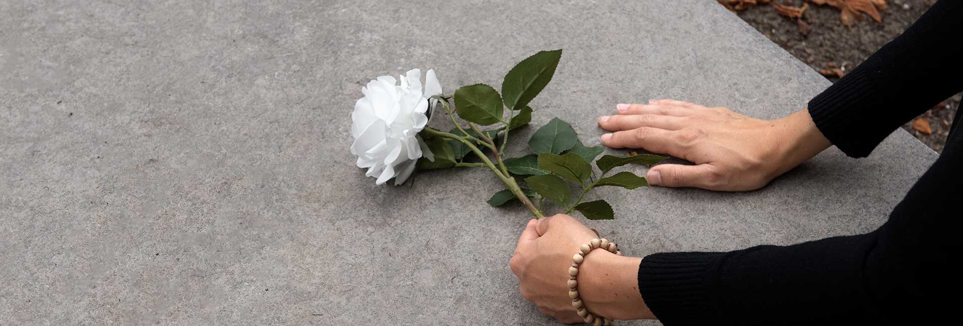Laying a flower at a funeral